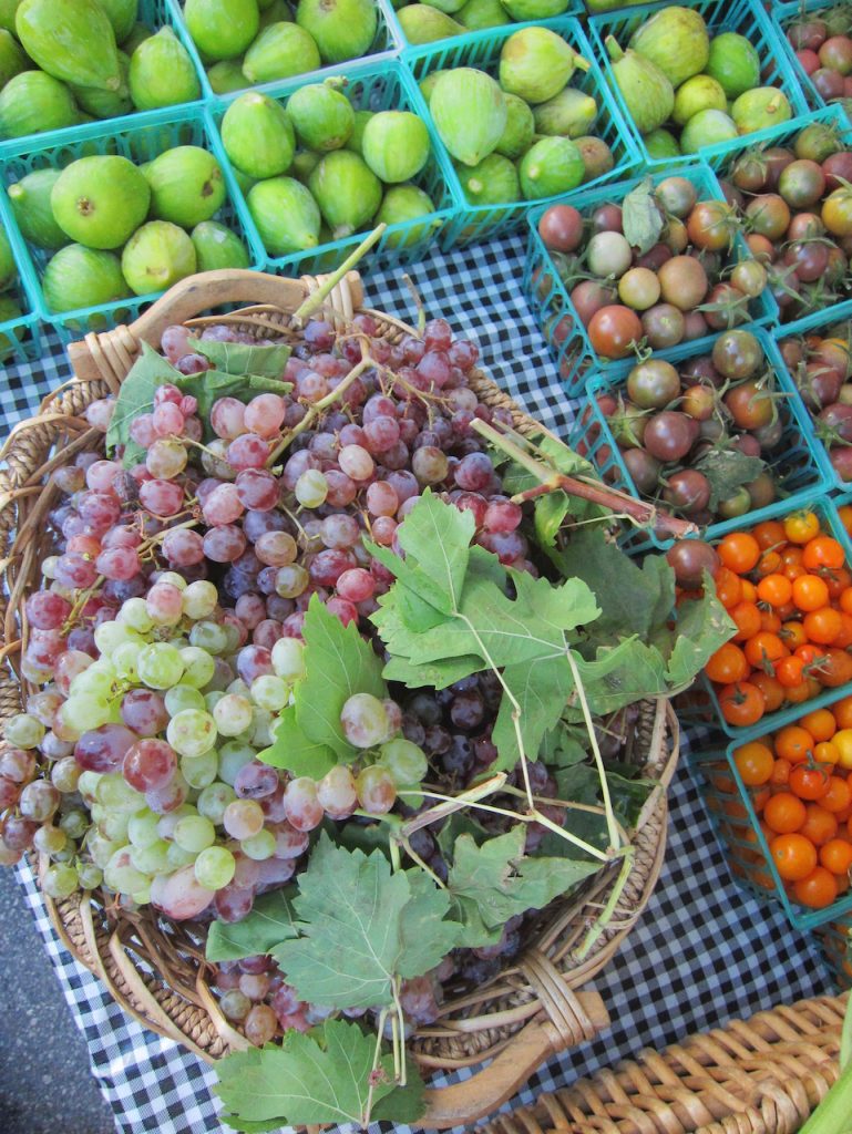 grapes with leaves in a basket