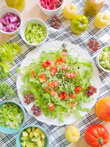 preparing Chicken Salad With Lime, Microgreens and Grapes