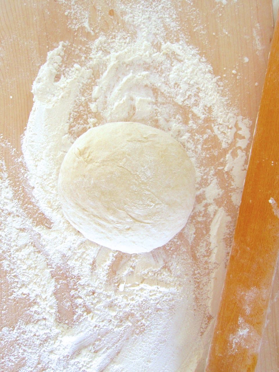 pizza dough on board