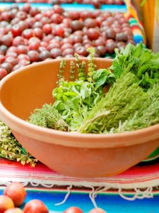 mint with other herbs in a bowl