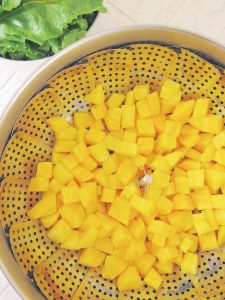 cut golden beets in steamer basket