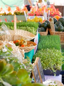 pretty display at farmers market with lush grasses