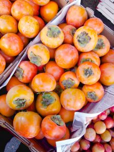 persimmons at the farmers market