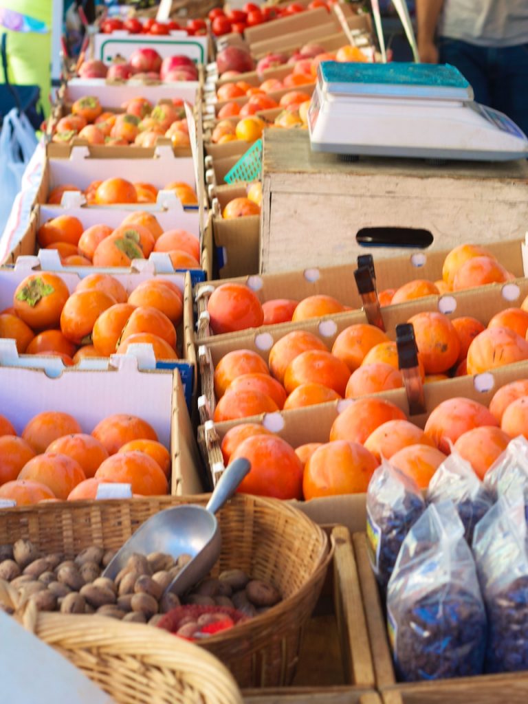 persimmons and nuts at the farmers market