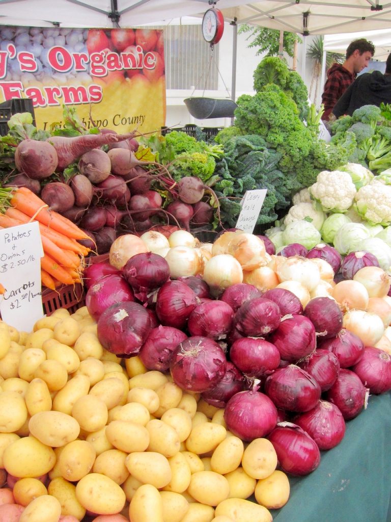 red onions at the farmers market