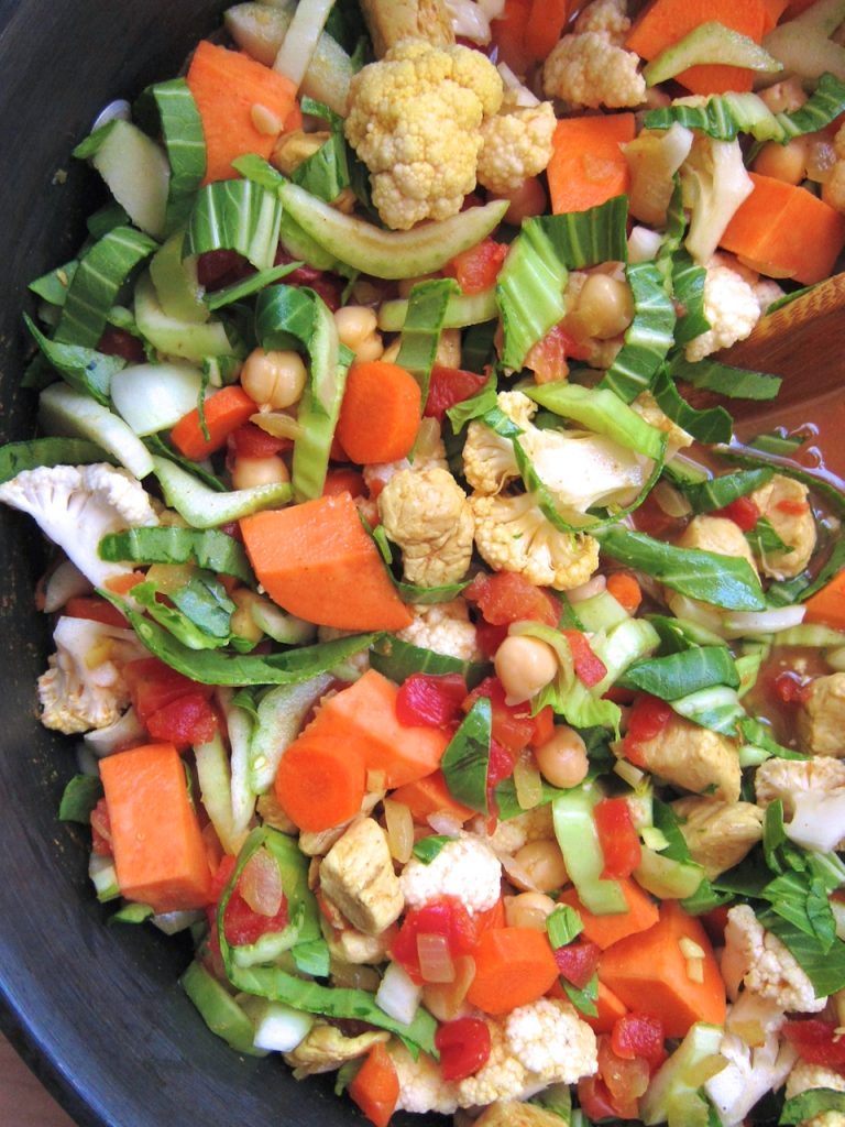 preparing coconut curry soup