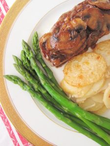 steak with caramelized mushrooms and onions