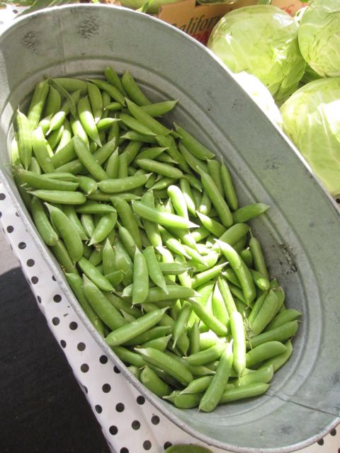 peas in large pan at farmer's market