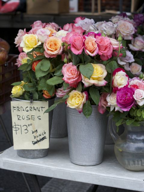roses in tall cans at farmer's market