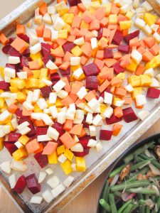 cut up beets and sweet potatoes on roasting pan