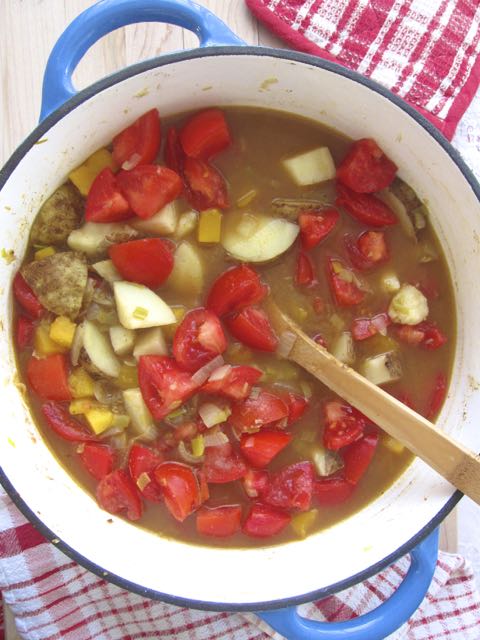tomatoes added to pot