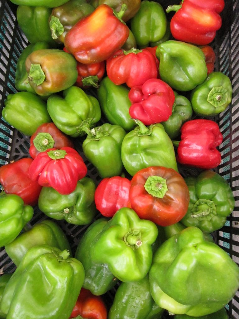 red and green peppers at the farmers market