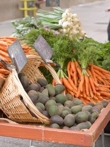 avocados and carrots at farmers market