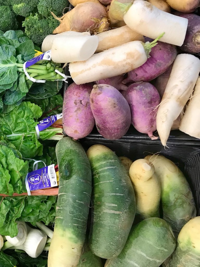 white, purple and green daikon radishes
