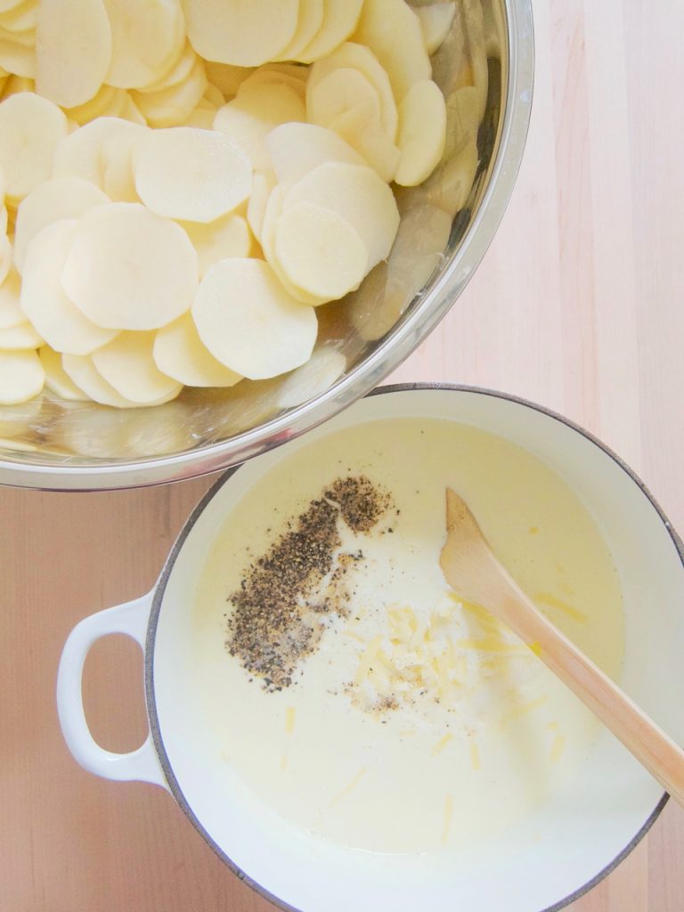 preparing Creamy Cheesy Scalloped Potatoes