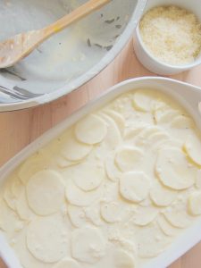 preparing Creamy Cheesy Scalloped Potatoes