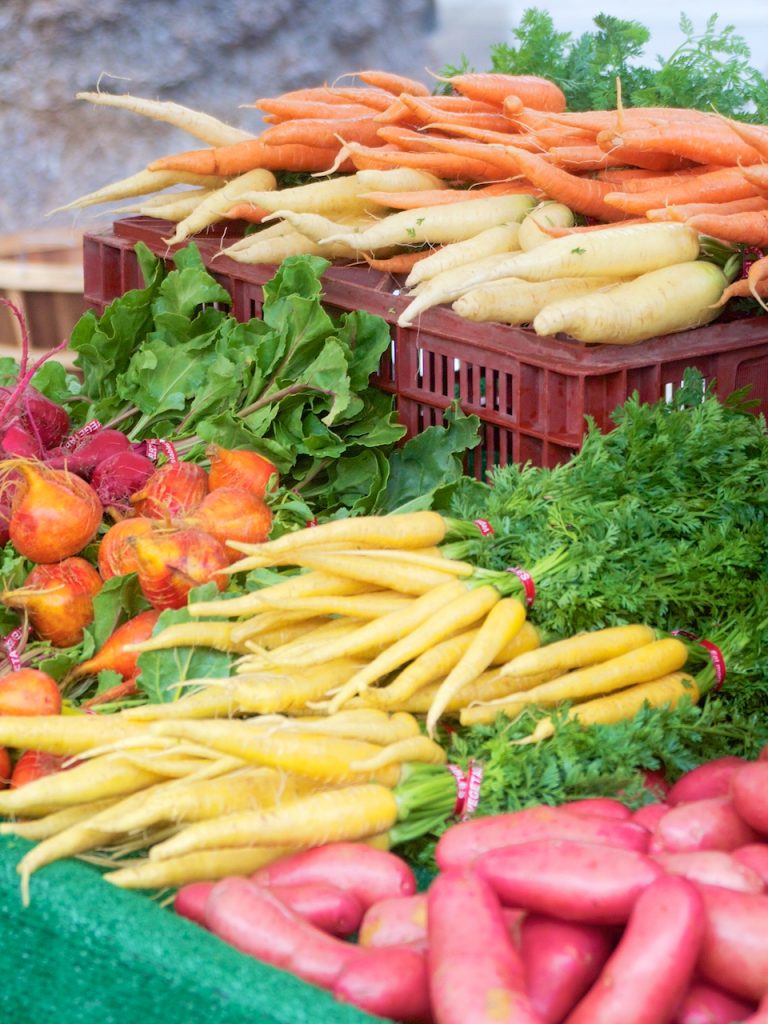 white carrots and beets at the farmers market