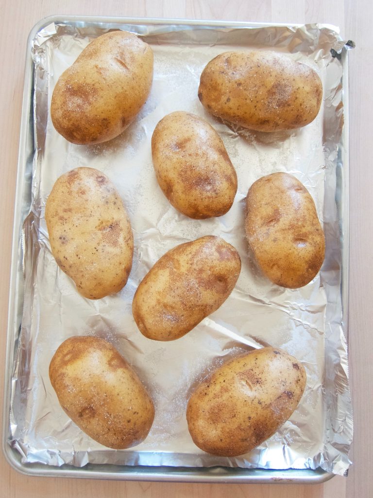 russet potatoes on baking sheet