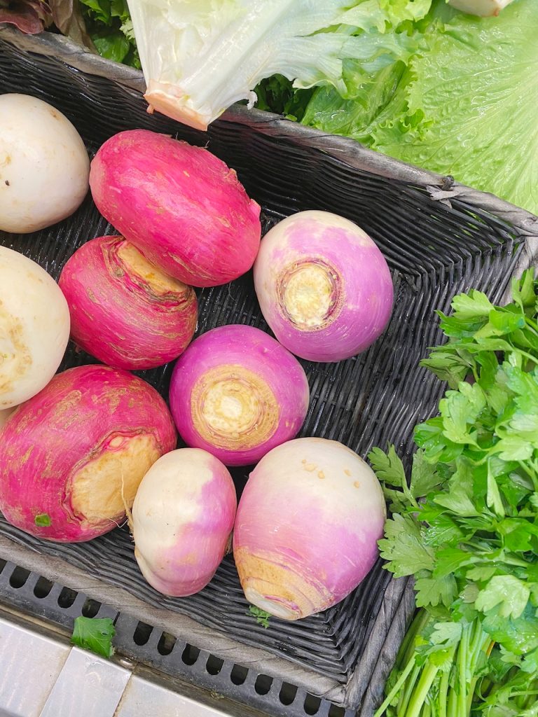 turnips in a basket at store