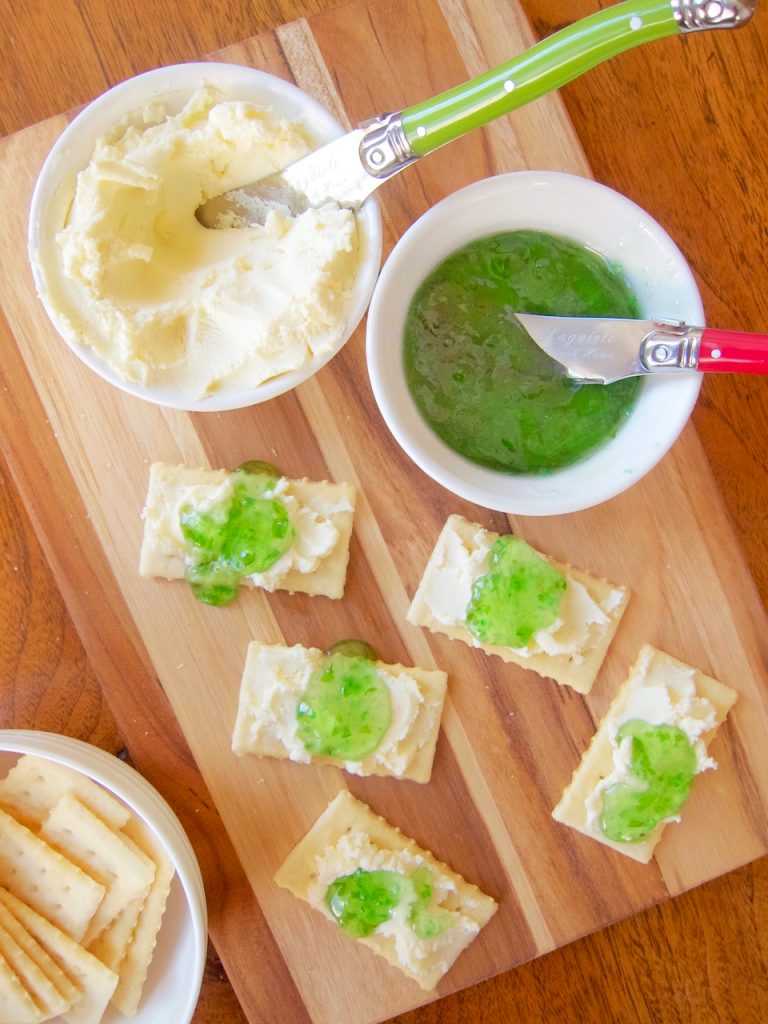 crackers with cream cheese and sweet green pepper jelly