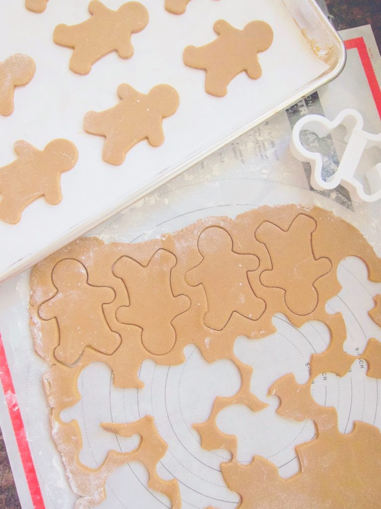 cutting out gingerbread cookies