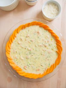 topping Salmon and Leek Pie with cheese