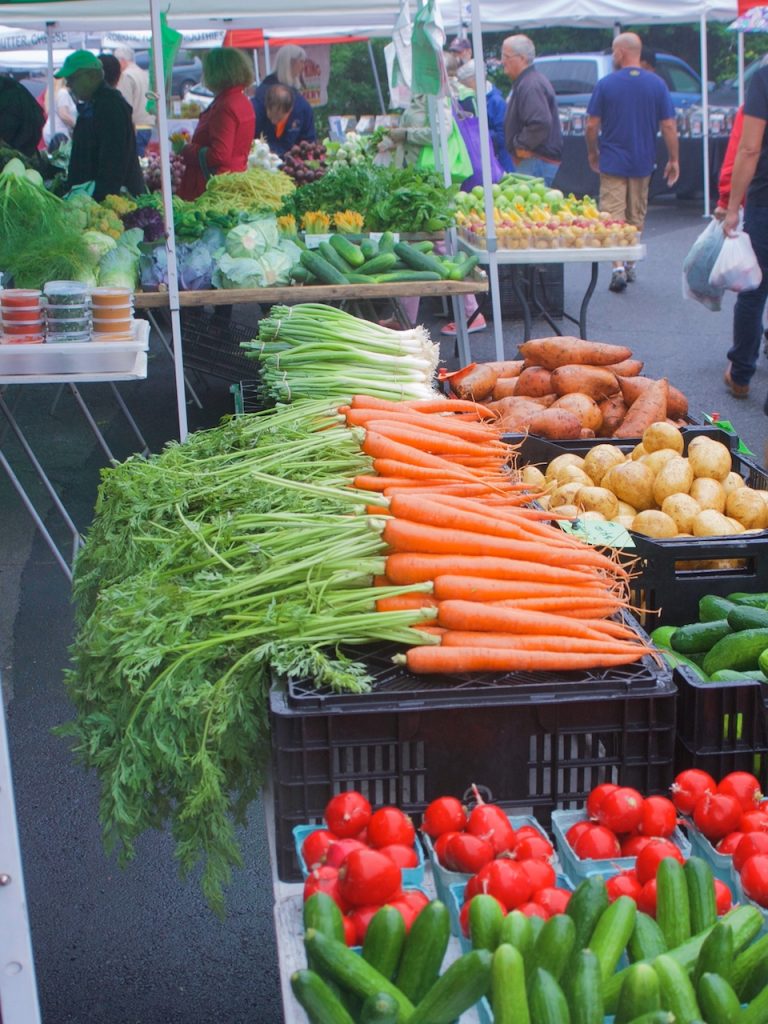 carrots and sweet potatoes at the farmers market