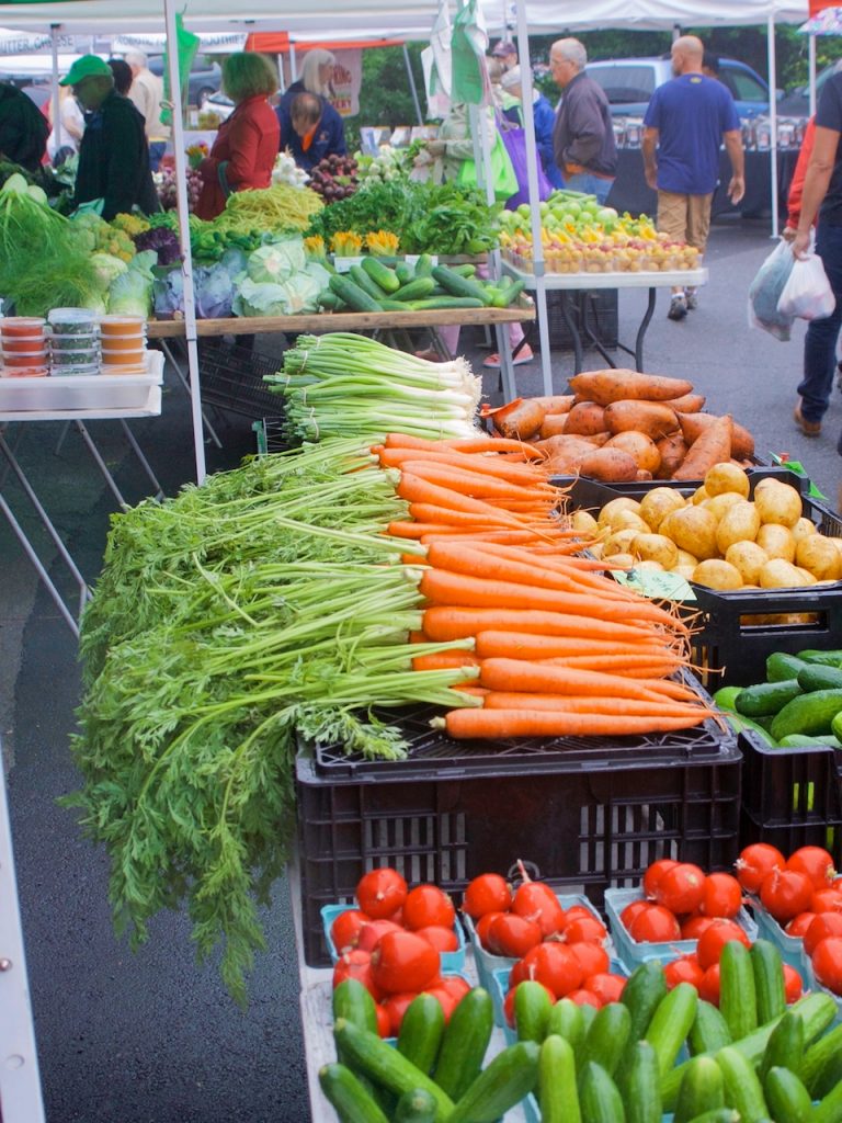 carrots and sweet potatoes at the farmers market